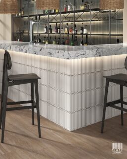 Some tiles adapt. Belle defines the space it enters.
The Belle series is designed to transition seamlessly across environments. In bathrooms, it introduces a calm, spa-like depth where texture replaces excess. In living and vanity spaces, it becomes a quiet backdrop that elevates materials around it.

Its fluted surface and soft arched geometry create a consistent rhythm, allowing the same tile to feel refined in residential settings and equally relevant in hospitality spaces like bars and lounges.

The colour palette supports this flexibility. Verde adds a grounded, contemporary tone for statement walls. Beige brings warmth into softer interiors. Blanco keeps the composition light, clean, and architectural.

With its 240 x 740mm format, Belle installs vertically to enhance proportion and continuity, making it suitable for feature walls, counters, and full-height applications.

One surface. Multiple expressions. Always composed.

#WallTilesIndia #CeramicTilesIndia #InteriorDesignIndia #Architectural Materials #TileDesign