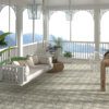 Moroccan patterned floor tiles with soft geometric motifs creating a relaxed veranda setting by Timex Ceramic