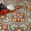 Moroccan vintage-style patterned floor tiles with earthy tones used in a kitchen space by Timex Ceramic
