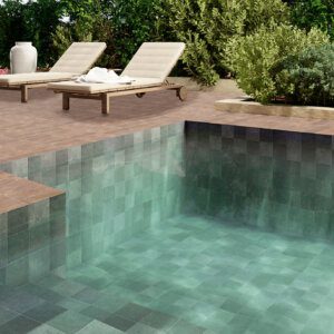 Small-format Moroccan patterned tiles in soft green tones used for pool interiors by Timex Ceramic
