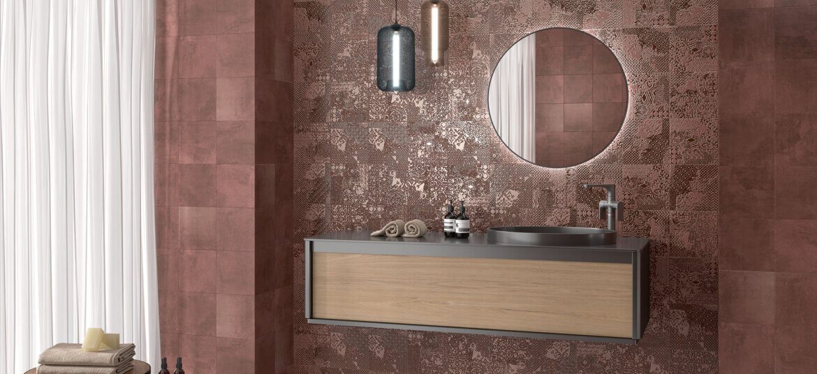 Patina-engineered porcelain tiles in a copper metal finish used as a bathroom backsplash by Timex Ceramic.