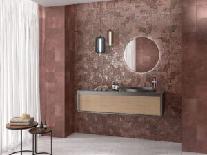 Patina-engineered porcelain tiles in a copper metal finish used as a bathroom backsplash by Timex Ceramic.